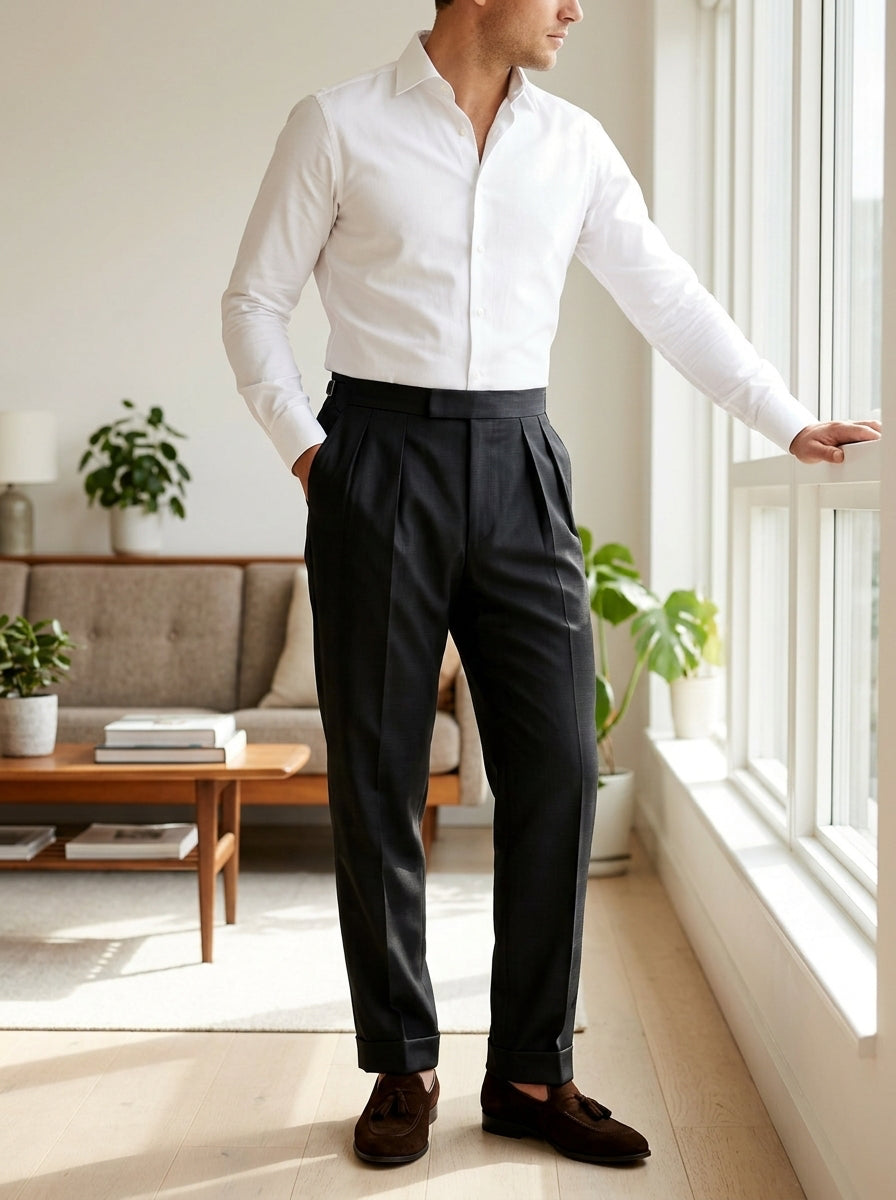 Black wool tailored trousers with wide waistband and double pleats